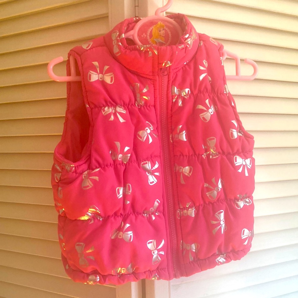 Pink puffer vest with silver bow ties for girls size 2T